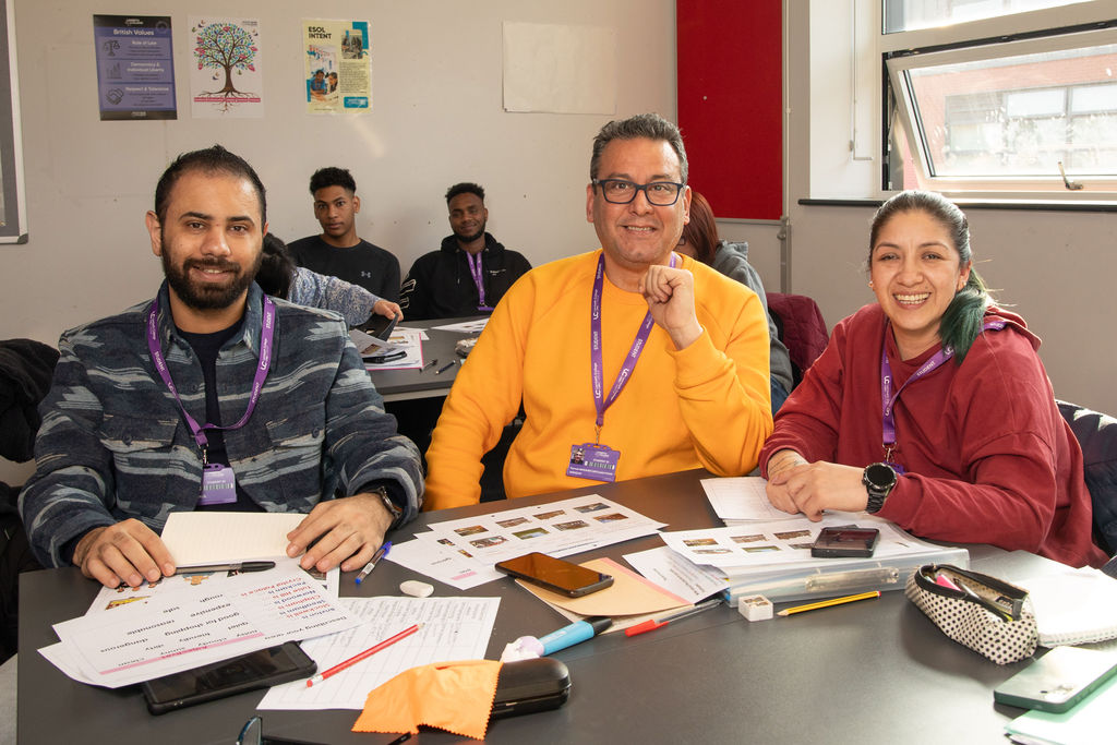 Two Lambeth College students, posing and smiling
